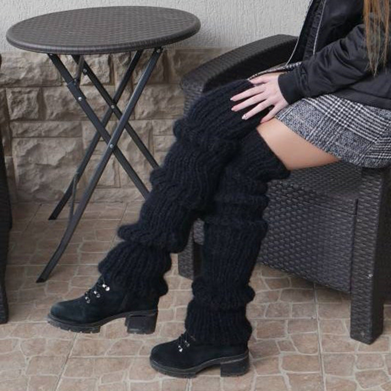 Grovstickade benvärmare i rosa över boots