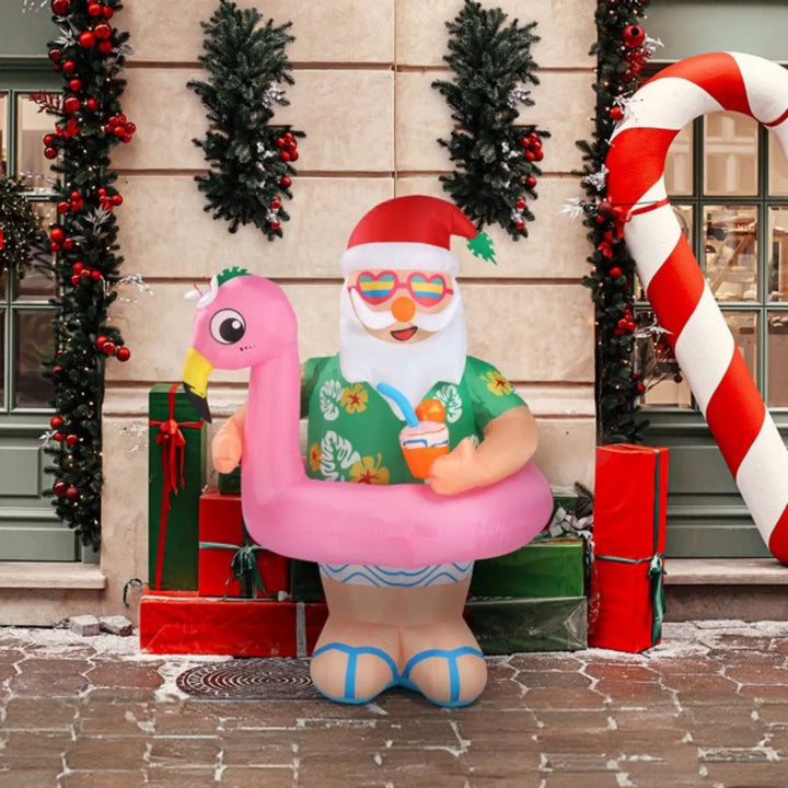 Uppblåsbar tomte i rosa flamingo