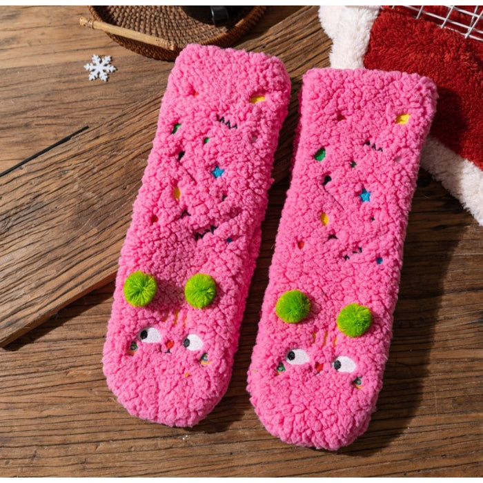 Värmekällan Fluffiga sockor med broderade ansikten och pompoms