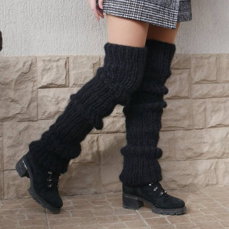 Grovstickade benvärmare i rosa över boots