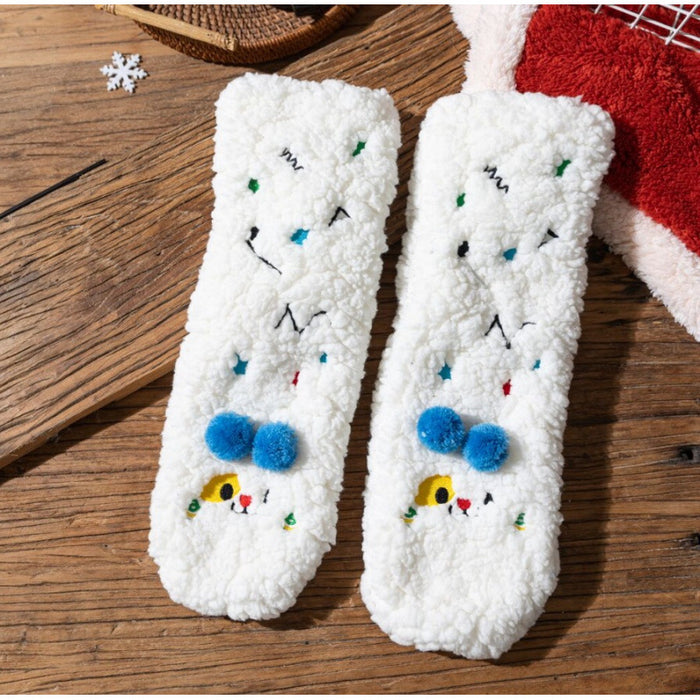 Värmekällan Fluffiga sockor med broderade ansikten och pompoms