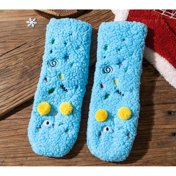 Värmekällan Fluffiga sockor med broderade ansikten och pompoms