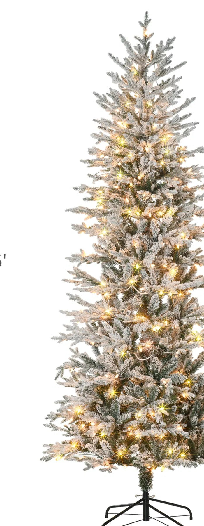 Stor snöflockad julgran med klara ljus