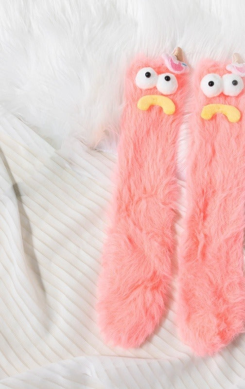 Värmekällan Fluffiga monstersockor med roliga ansikten