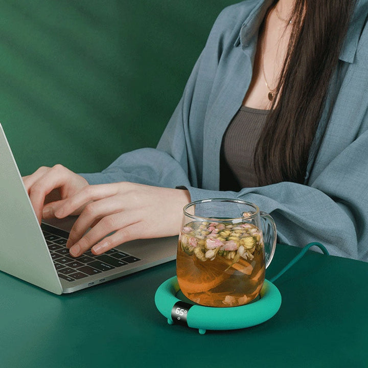 Värmekällan™ Söt muggvärmare i pastell som håller kaffe och te varmt i lugn takt