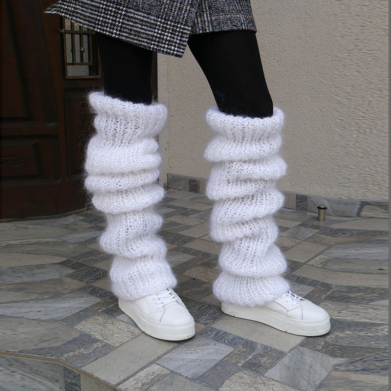 Grovstickade benvärmare i rosa över boots