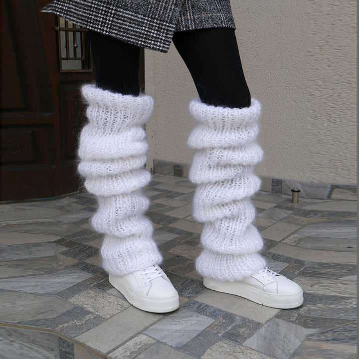 Grovstickade benvärmare i rosa över boots