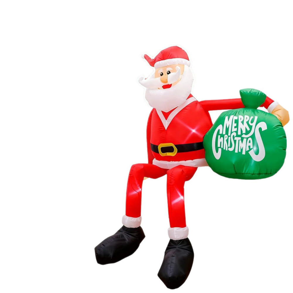 Stor uppblåsbar tomte i trädgård