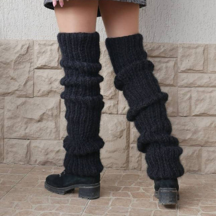 Grovstickade benvärmare i rosa över boots