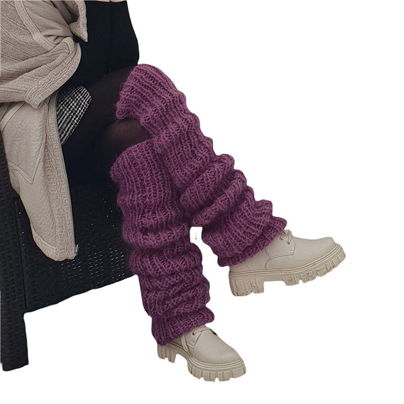 Grovstickade benvärmare i rosa över boots