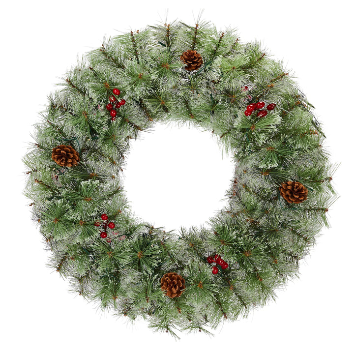 Två julkransar med ljus och röda bär
