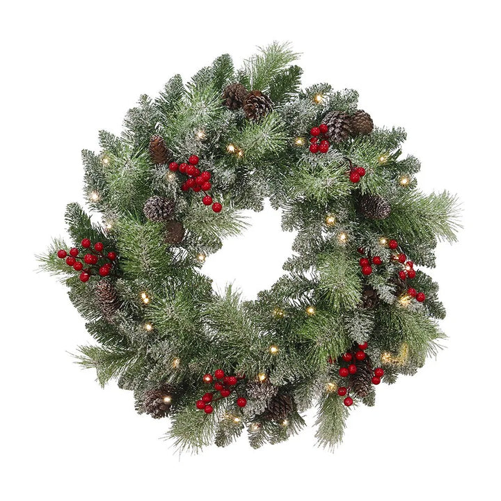 Upplyst julkrans med kottar och bär